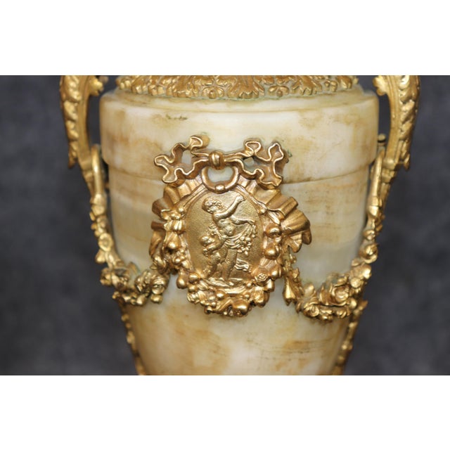 Elevate any interior with this magnificent pair of 19th-century alabaster and gilt bronze mounted table lamps, exquisitely...