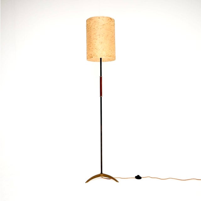 A stylish and extremely well made vintage brass and steel floor lamp with original textured shade. This was made in...