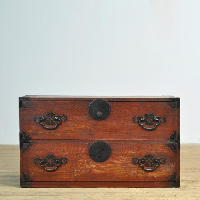 Traditional Japanese Tansu chest of drawers from the 1870s. Manufactured during the late Meiji era (1868-1912). This piece...