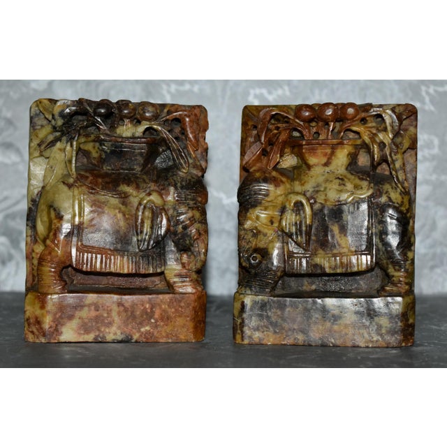 Vintage (1950's) Pair of Bookends have a Chinese Style. Made of Soapstone. Carved Elephant Details. Multi-Colored. The...