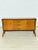Beautiful vintage chest of drawers from the 1960s in classic German design. The piece impresses with its curved shape,...