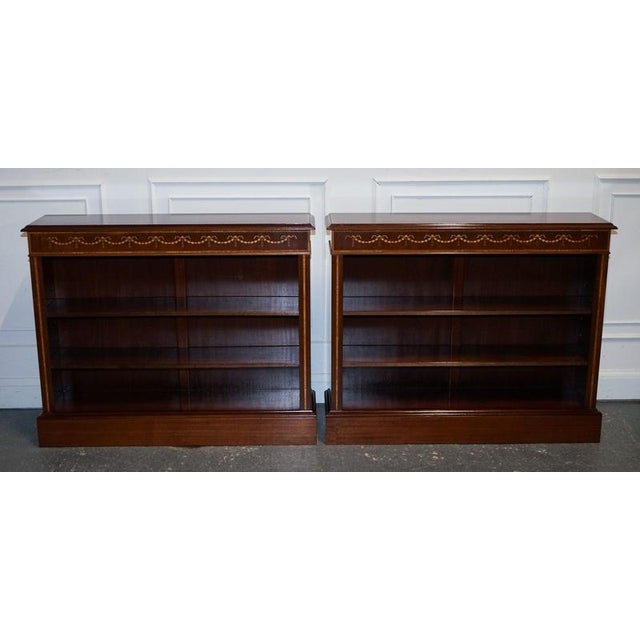 A fine pair of vintage Edwardian style Sheraton dwarf open bookcases, beautifully designed with elegant proportions,...