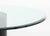 Modern Glass Top Pedestal Table, the circular beveled glass top above cylindrical black patinated metal base. 29.25" H x...
