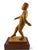 Donald Nelsen painted wood carving depicting a walking male figure wearing a traditional red fez, mounted on a two-tone...