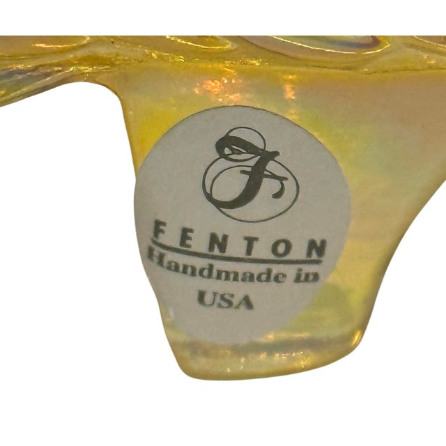 This vintage Fenton iridescent amber carnival glass cat head slipper shoe features a charming embossed cat design on the...