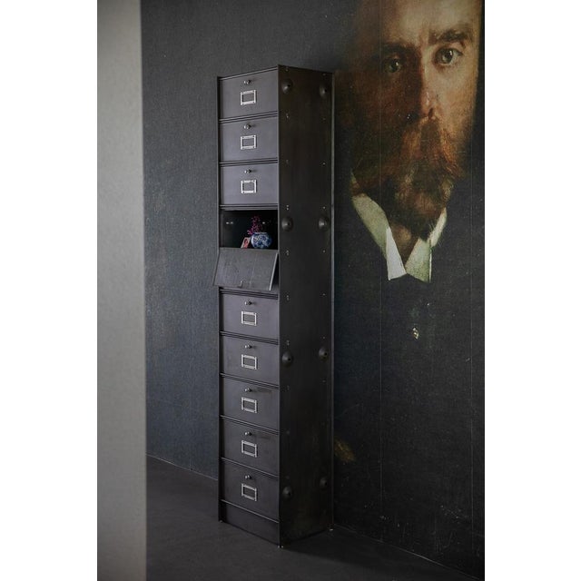 A classic cabinet with a clean, industrial aesthetic and functional design. The striking doors offer practical storage...