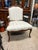 French Provincial Louis XV design with striped fabric upholstery and carved walnut wood. This piece features a classic...