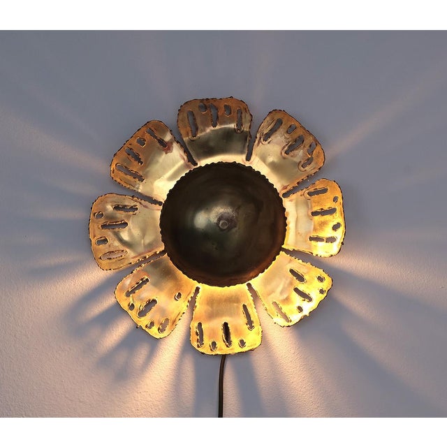 Brutalist brass wall lamp in the shape of a flower produced by Holm Sørensen. Designed by Svend Aage Holm Sørensen in the...