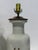 A refined and thoughtfully composed near pair of Chinese export style armorial porcelain table lamps, custom mounted by...