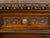 An Italian walnut small cabinet from the early 19th century, with single drawer over single door, carved foliage, vase and...