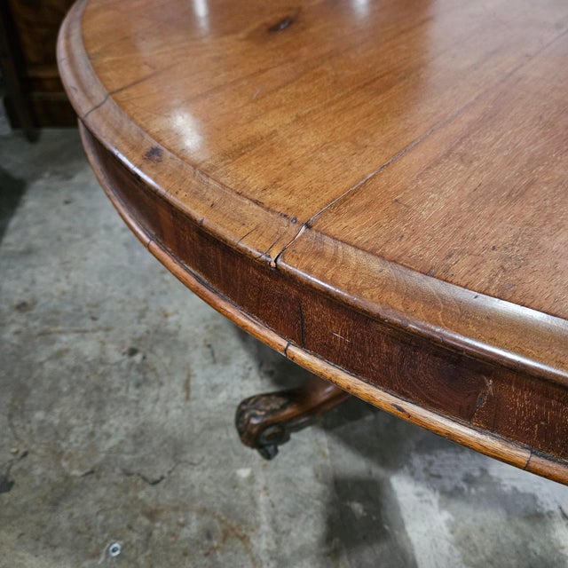 This Victorian Mahogany Round Tri-Leg Pedestal Dining Table would work great in a breakfast room or small dining room. It...