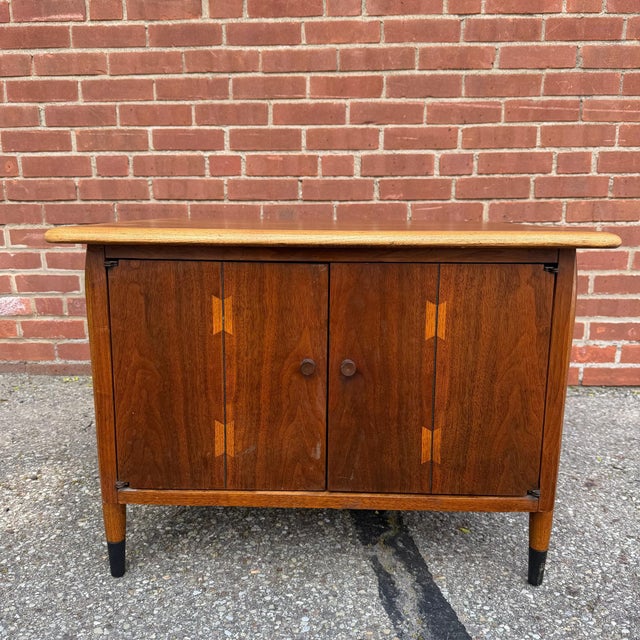 Lane Acclaim walnut end table with the collection’s signature dovetail inlay detailing worked into the top and cabinet...