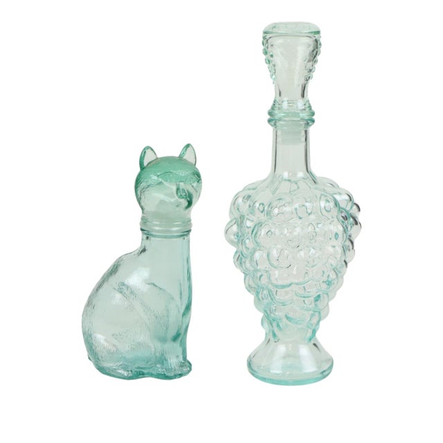 A charming set of two Italian carafes or liqueur bottles made by Vetreria Etrusca; one is shaped like a cat and the other...