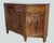 We offer this important Italian sideboard, crafted in the very early 19th century, a striking piece that combines...