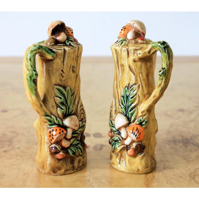 Pair of mid century ceramic salt and pepper shakers with mushroom motif. No makers mark. Some small chips. One is missing...