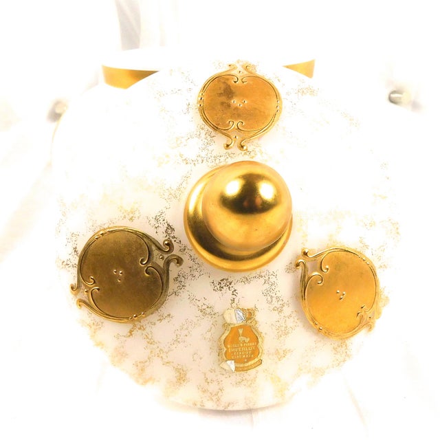 This is a white footed, covered dish with a matching lid. The lid has an Imperlux tag as shown. The dish is glass in white...