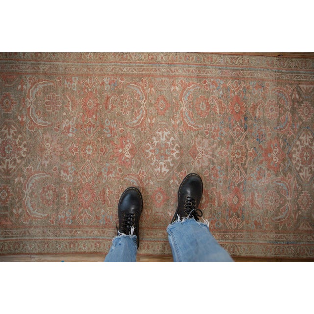 Allover covered field in a Herati design motif. Wrapped by narrow banded inner and outer minor borders in a meandering...