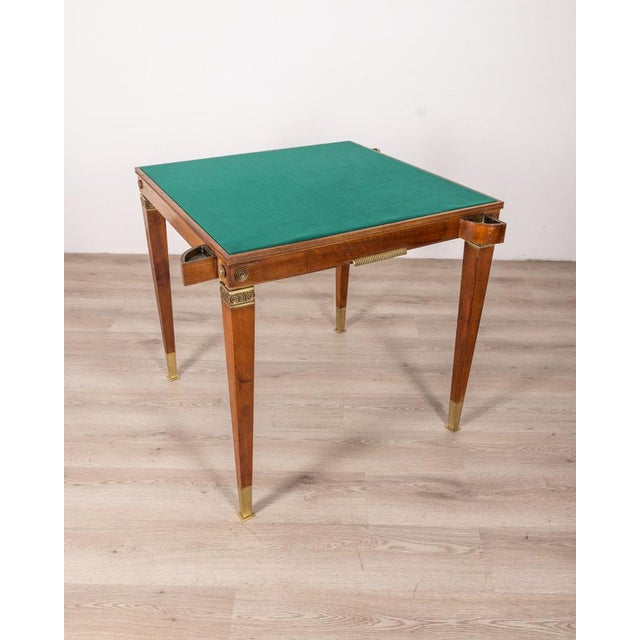 Four-seater gaming table, made of wood with golden brass inserts, there is a drawer for cards and chips and four ashtrays,...