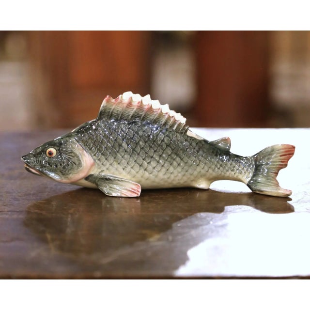 This lively barbotine rainbow trout vessel fish was sculpted in Fives-Lille, France circa 1950 and exemplifies the...