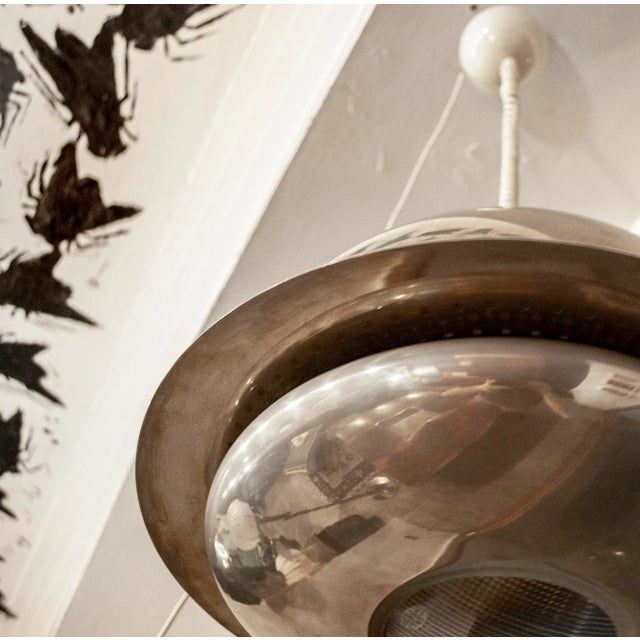 Chromed metal chandelier, with glass details. Nictea model Designer Afra and Tobia Scarpa FLOS manufacturer 1961 Up to...