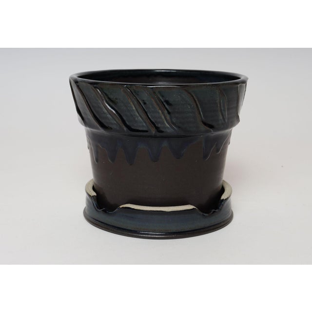 Studio ceramic planter with saucer/plate/display stand by ceramicist, Deanna Nichols (b. 1942-2017, Missouri). Holding a...