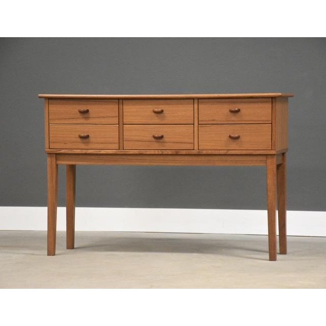 A mid century modern teak sofa table or entry way table with six drawers made by FBJ Mobler. Excellent original condition....