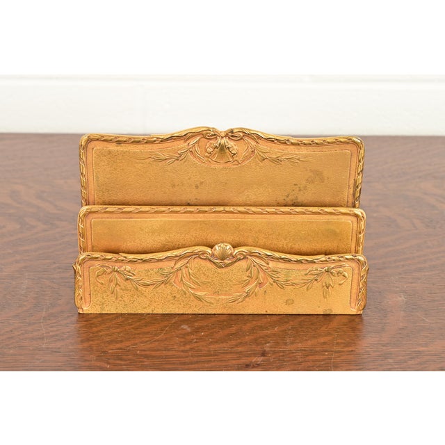 A gorgeous antique Art Nouveau period Louis XVI style gilt bronze letter rack By Tiffany Studios (signed to the underside)...