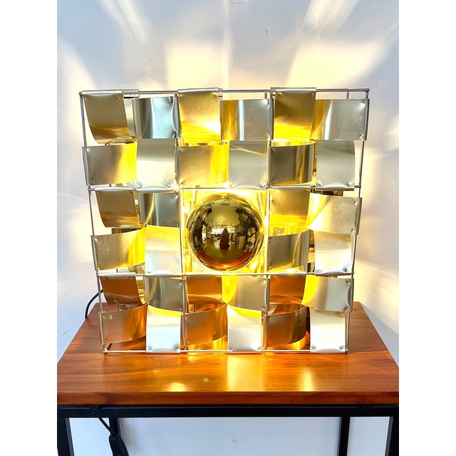 A superb atlas lamp designed and produced by max sauze in 1975, this rare piece is particularly sought after in its gold...