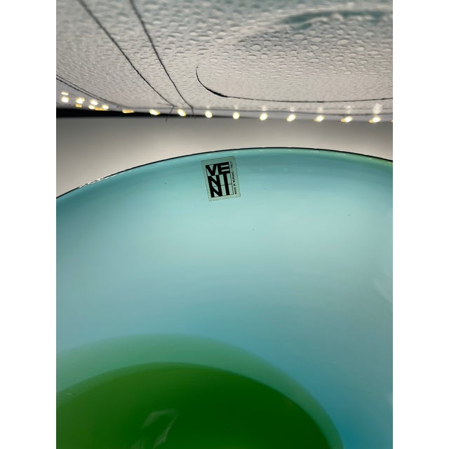 Venini plate from the Coreani series, transparent in color with overlapping spiral bands of blue and apple green. The...