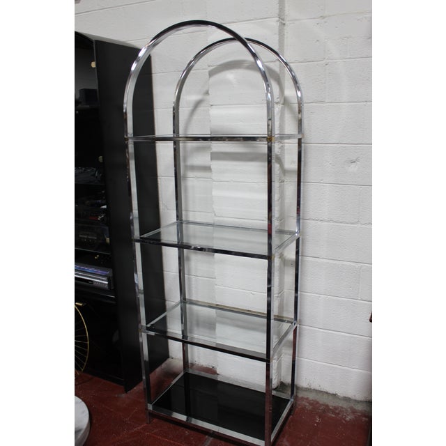 An Iconic chrome & glass shelving unit designed by Milo Baughman for Design Institute of America (D.I.A.) circa 1970s....