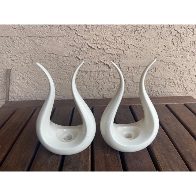 This pair of china candlestick holders are vintage Lenox with the green stamp on the bottom, indicating they were made...