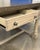 A burnished stainless top and decorative nailhead trim surround the top edge of the bistro tables or a floating kitchen...