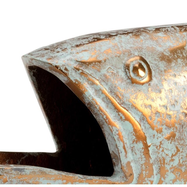 Perfect for completing the design in your coastal or lakefront home, norman is a fish figurine made of copper with a...