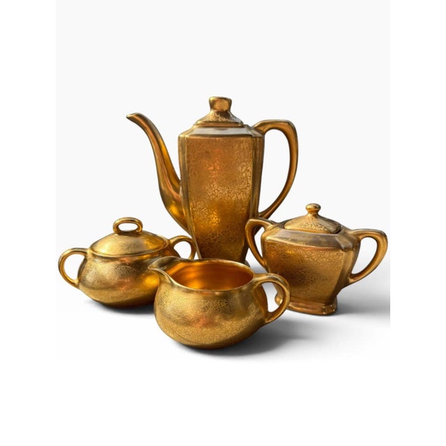Exquisite vintage four-piece tea and coffee service by Wheeling Decorating Co., featuring the highly decorative “Doves,...