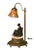 This piece redefines one of a kind! This lamp was designed around the central statue. This beautiful statue is an antique...