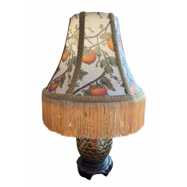 A one-of-a-kind custom silk lampshade featuring a richly detailed persimmon botanical design on linen-backed silk. The...