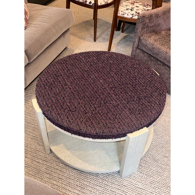 This is a customized 'Anees: Eden Coffee Table' with COM fabric top. 'Aspen Ceruse' wood finish. Overall: 36″ Diameter x...