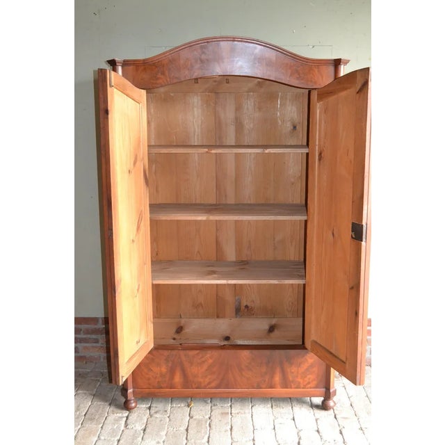 19th century German mahogany Art Deco maid's cupboard. The height is 185 cm. The width is 112 cm. The depth is 50 cm....