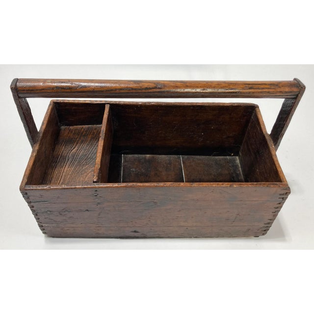 Antique handmade primitive wood tool caddy. Features sturdy handle and two compartments, one more shallow than the other....