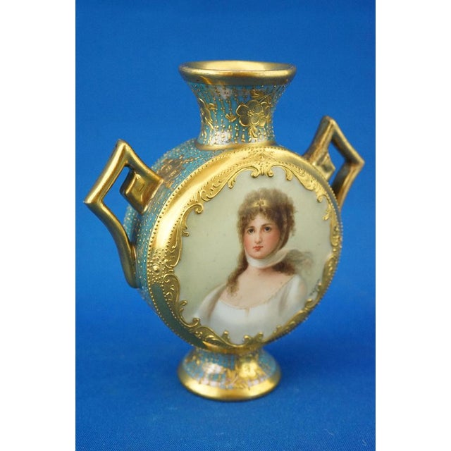 Item description: a stunning perfume bottle or small two-handled vase with a rounded body and flared mouth, made of fine...