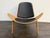 Design Plus Gallery presents a Shell Chair in the style of Hans J. Wegner. This lounge chair draws from the iconic three-...