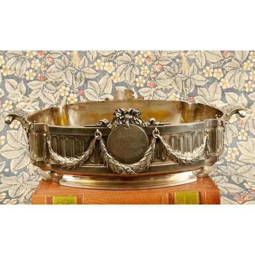 Fine antique silver plated presentation bowl of oval form with classical neoclassical decoration. The body with fluted...