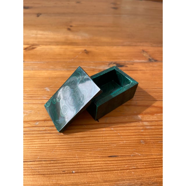 Petite malachite box with lid to store your tiniest treasures. Worry people for scale, not included.