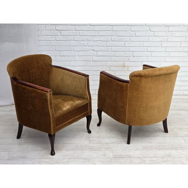 1960s, pair of Danish armchairs. Original green furniture velour, ash wood legs and armrests, brass springs in the seat....