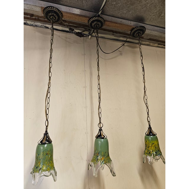 3 wrought Irons handmade pendant with flowing blown glass.