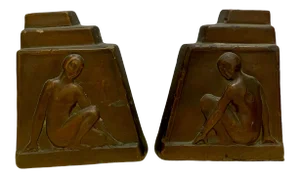 1930s Art Deco Pompian Bronze Clad Bookends.- a Pair