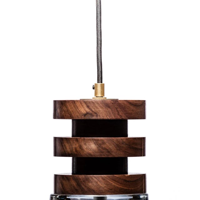 The Malmo Glass pendant. Handcrafted in Seattle from the finest sustainably harvested walnut in America, and painstakingly...