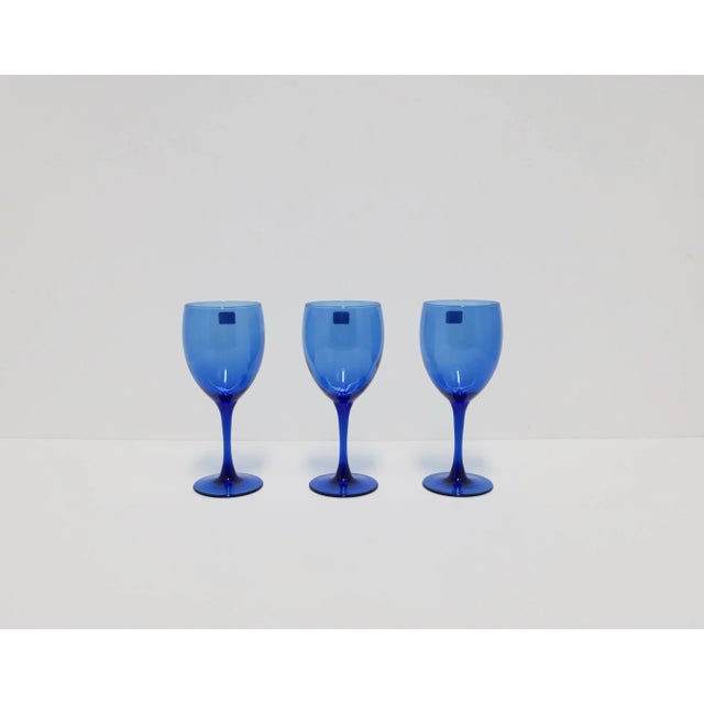 A beautiful set of three (3) French blue wine glasses, circa late-20th century, France. Glasses can be used for wine,...