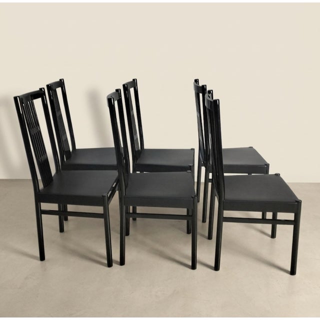 Typically constructed in lacquered ash wood with an open-pore finish. The square seats are upholstered in plastic material.
