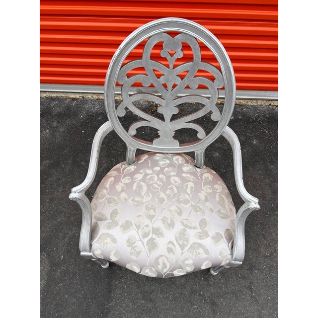 This classic single accent chair is Hollywood Regency style and dates to the 1990’s. The chair has a beautifully carved...